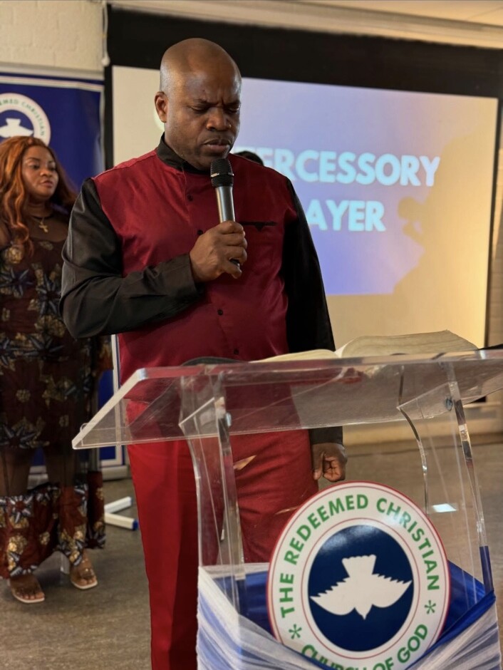 Pastor Dennis Shakka leading prayer at Glory Tabernacle Parish